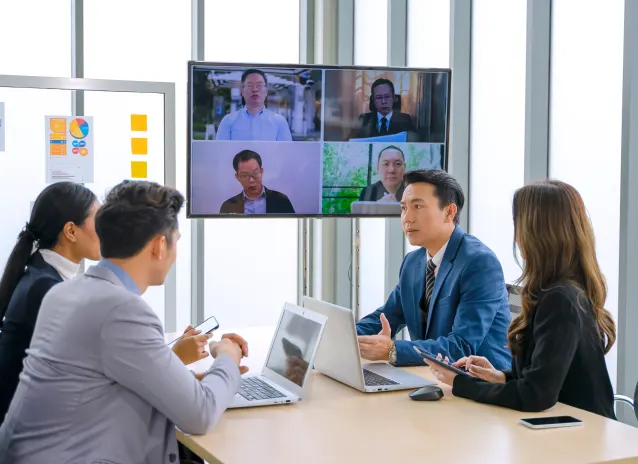 Qlik video conference in meeting room for business professionals to gain competitive edge.